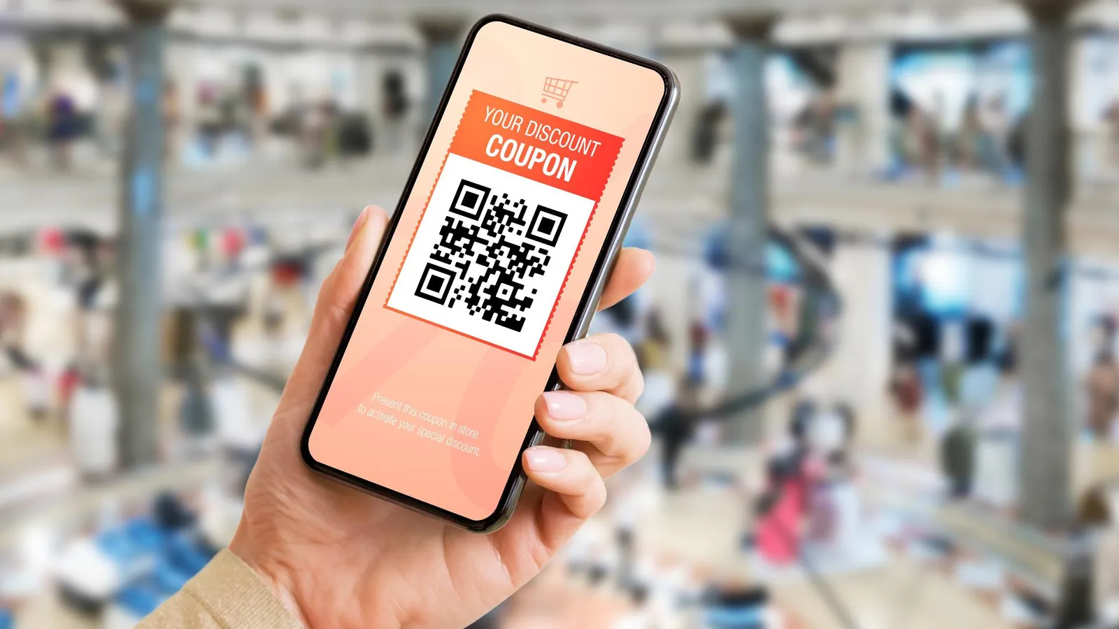 Entering a referral discount code on a smartphone at checkout