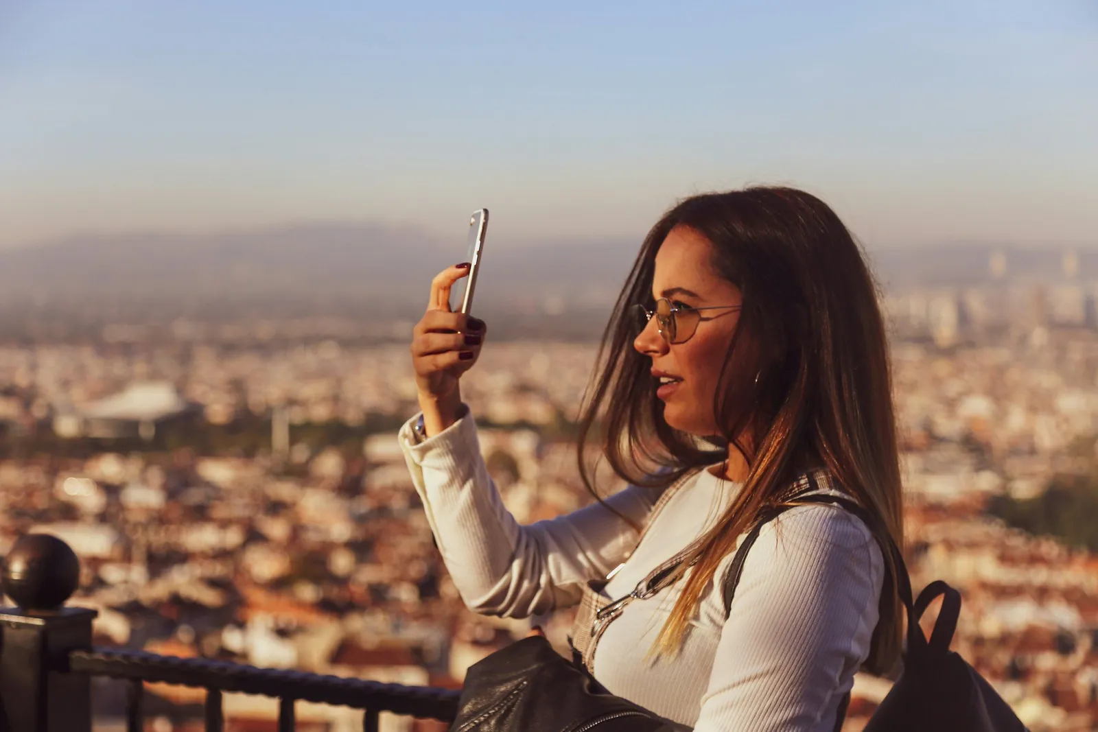 Traveller reviewing their phone while travelling internationally